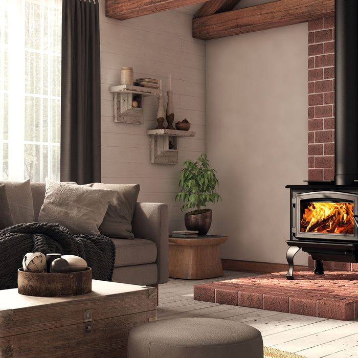 Modern living room with the Osburn 1700 Wood Burning Stove setup, brick hearth, and cozy rustic interior.