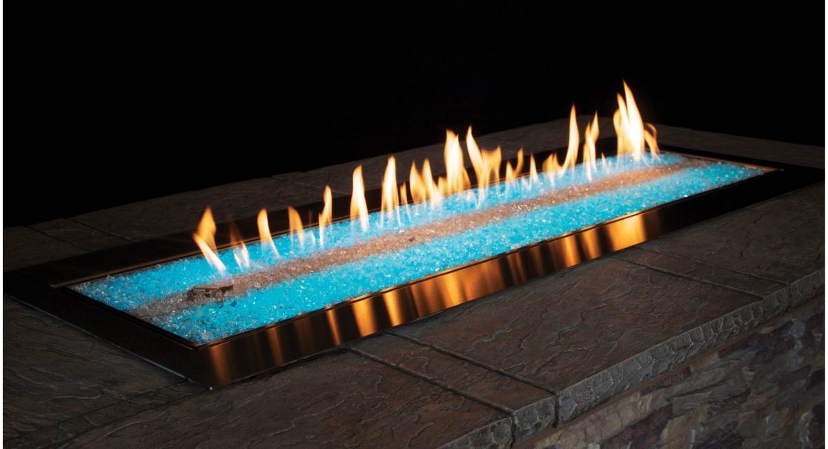 Carol Rose Premium Outdoor Fire Pit with blue LED Lights at night