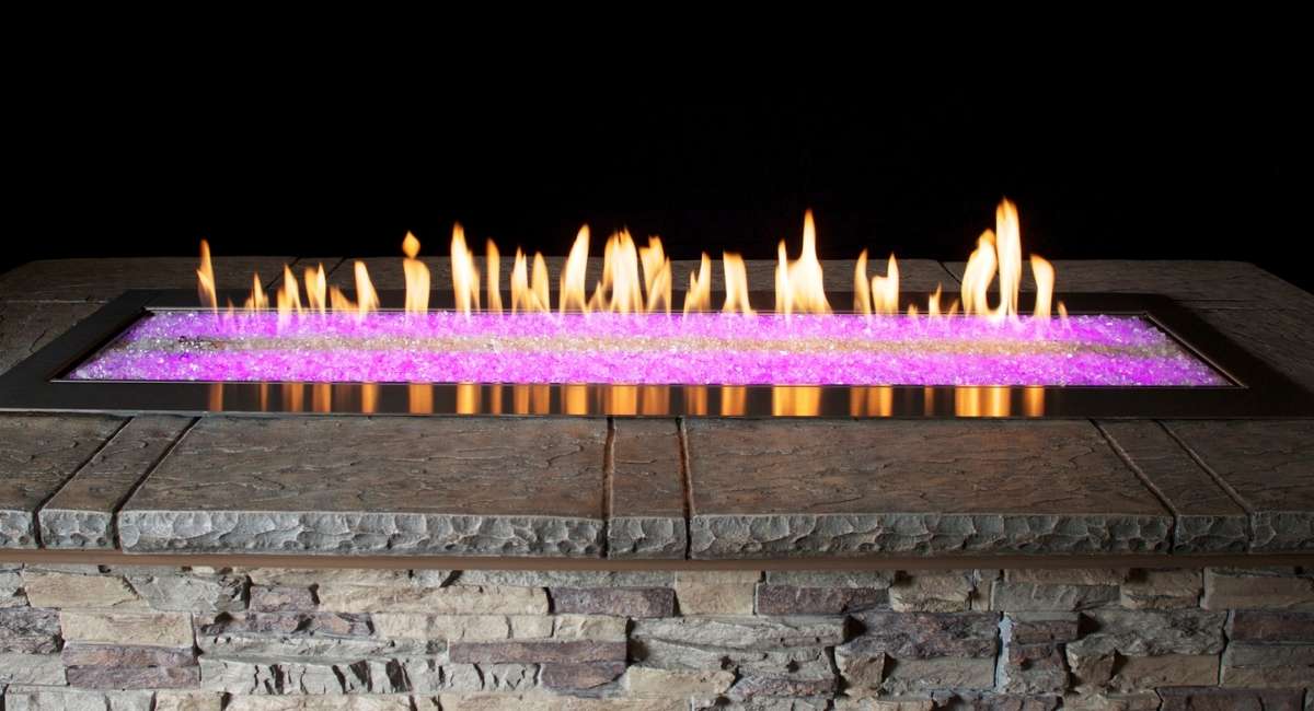 Carol Rose Premium Outdoor Fire Pit with pink LED Lights at night