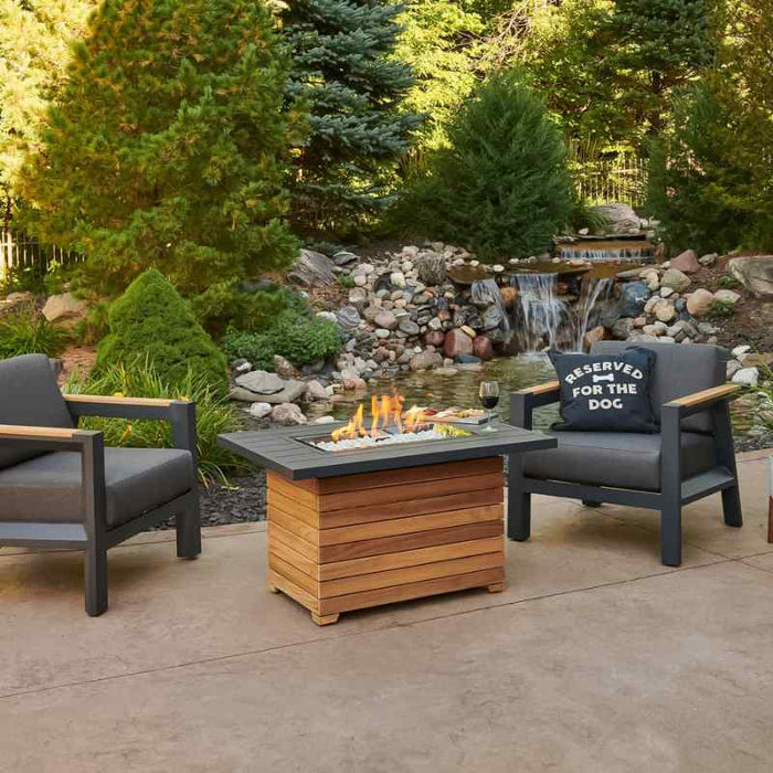 Darien Rectangular Gas Fire Pit Table with Aluminum Top with Clear Tempered Fire Glass Gems and Wine along near the Water Falls