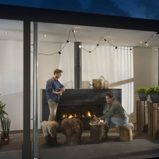 Element4 Modore 140 Outdoor installed at the Terrace with with Ceramic Glass, Black Mesh Safety Screen plus ceramic fire bed and heat-resistant ceramic fibers Logs set