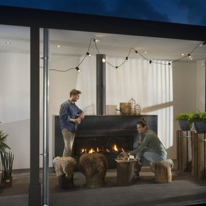 Element4 Modore 140 Outdoor installed at the Terrace with with Ceramic Glass, Black Mesh Safety Screen plus ceramic fire bed and heat-resistant ceramic fibers Logs set