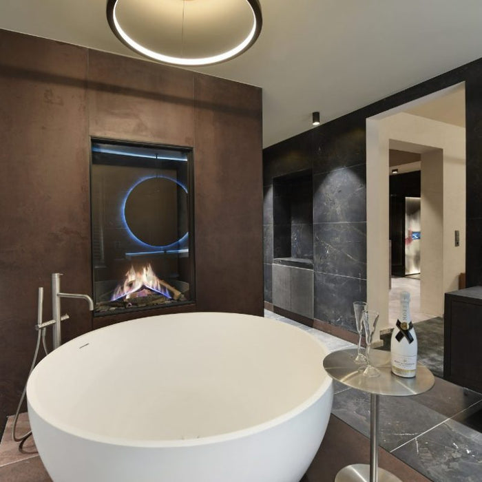 Element4 Sky Medium Installed in the Bathroom with Real Flame Burner with True-to-Nature Cleaved Wood Logs