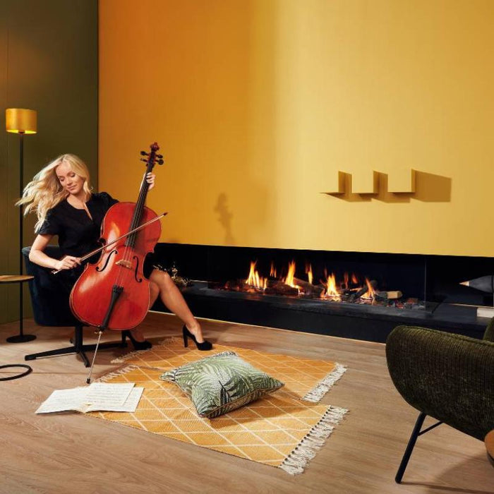 Element4 Summum 190 3S Installed in a Music Room with Real Flame Burner with True-to-Nature Wood Logs and a Lady Playing Cello