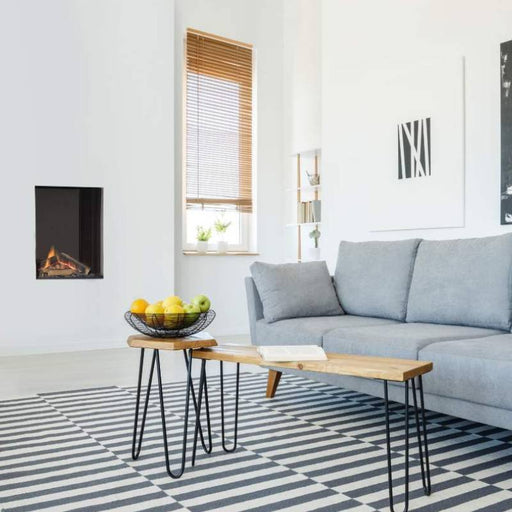 Element4 Sky Small Installed in the Living Room with Real Flame Burner with True-to-Nature Cleaved Wood Logs