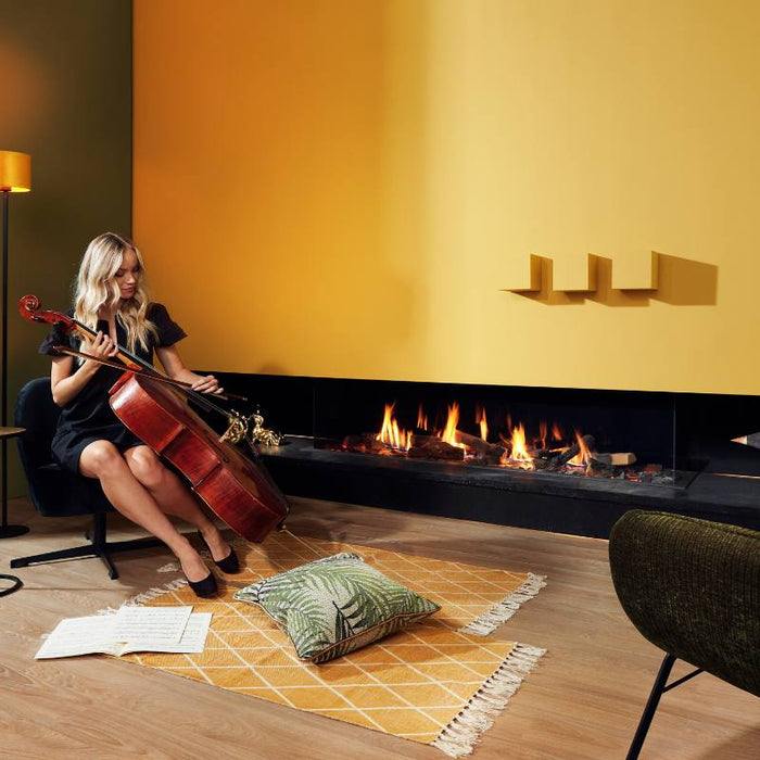 Element4 Summum 190 3S installed in a Music room with Real Flame Burner with True-to-Nature Wood Logs and a lady playing Cello