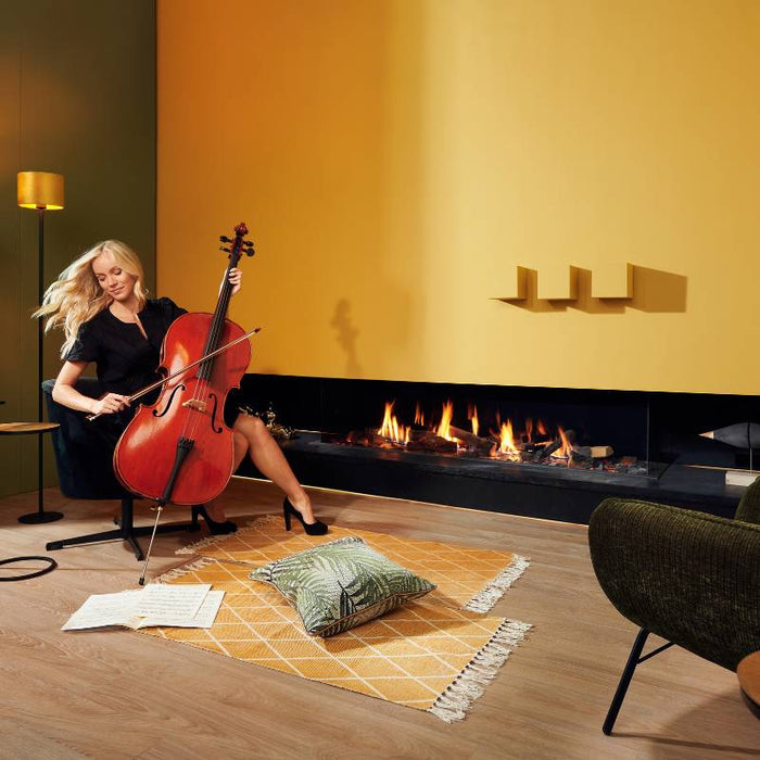 Element4 Summum 190 3S installed in a Music room with Real Flame Burner with True-to-Nature Wood Logs and a lady playing Cello V2