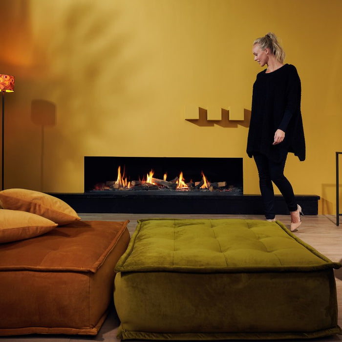 Element4 Summum 190 F with a gorgeous lady relaxing at the Living room while watching the Real Flame Burner with True-to-Nature Wood Logs