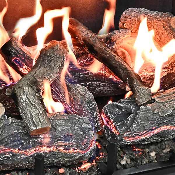Grand Canyon GlowFire Arizona Weathered Oak Charred Vented Gas Log Set close up view of logs glowing and on fire