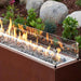 HPC Fire Linear Glass Wind Guards Placed in Linear Size Fire Pit with Rolled Lava Stones 