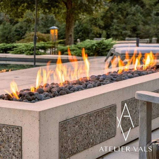 HPC Fire Linear Trough Fire Pit Burner Insert placed in Outdoor  Area with Black Ceramic River Rock
