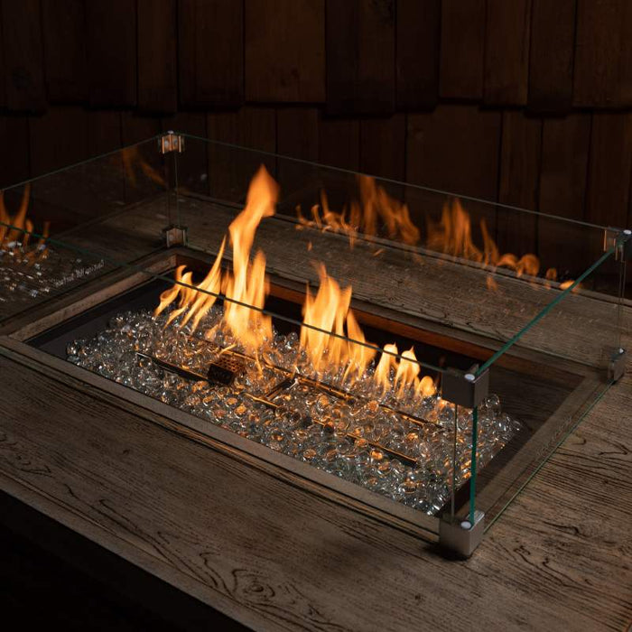 HPC Fire Rectangular Glass Wind Guards Installed in a Rectangular Fire Pit with H-Burner and Clear Tempered Glass Gems