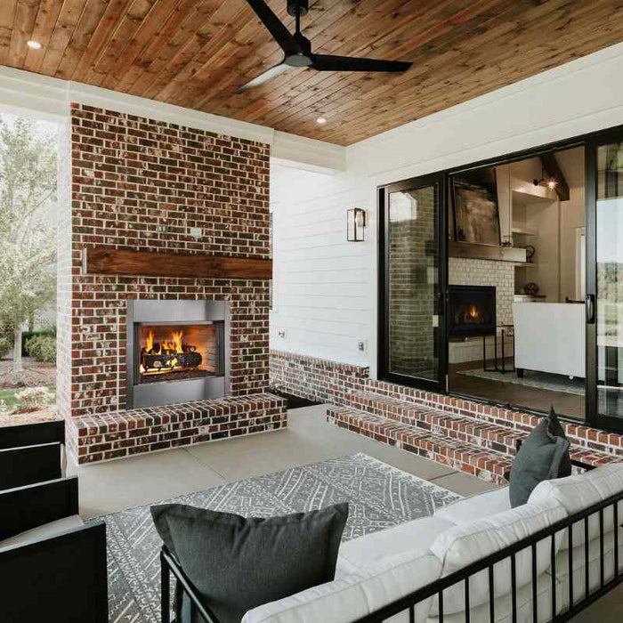 Majestic Villawood 36" Outdoor Wood Burning Fireplace Placed in Front Porch Setup with Traditional Brick and Stainless Steel Grate