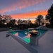Malibu Fire Bowl - Powder Coated Metal White place at the Poolside with Black Fire Glass plus Fire Buner On