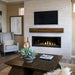 Napoleon Ascent Premium 56 Linear Direct Vent Gas Fireplace placed in Livingroom installed with MIRRO-FLAME Porcelain Reflective Panel with Topaz Glass Embers