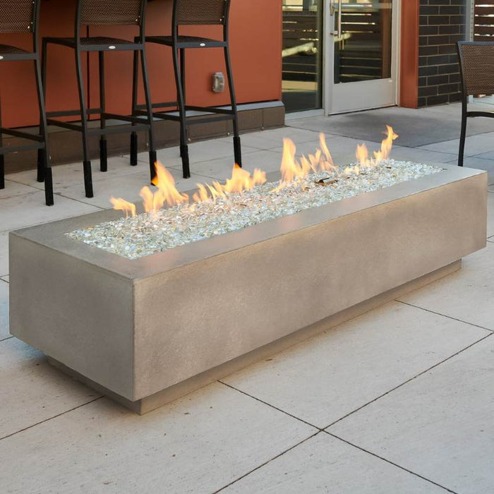 Natural Grey Cove 72 Linear Gas Fire Pit Table at the Front Yard with Clear Tempered Fire Glass Gems plus Fire Burner On