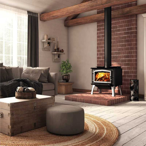 Osburn 1700 Wood Stove with Brushed Nickel Door Overlay and Brushed Nickel Straight Legs on Brick Hearth