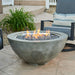 Outdoor Greatroom Natural Grey Cove 42 Round Gas Fire Pit Bowl Placed at Front Yard with Tumbled Lava Rock plus Fire Burner On