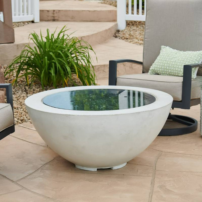Outdoor Greatroom White Cove 42 Round Gas Fire Pit Bowl Placed at Front Yard with Clear Tempered Fire Glass Gems plus Fire Burner On and Grey Glass Burner Cover