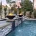 Reno Fire & Water Bowl - Hammered Copper  31 Placed in Poolside Installed with Black Pebbles