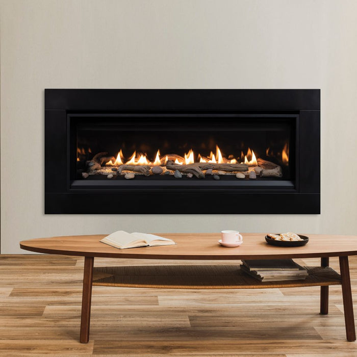 Superior 55 Direct Vent Linear Gas Fireplace DRL3555 close-up with black matte surround, driftwood log set, and river rocks 8a8a6611-acc6-47da-bc29-2278757ae784