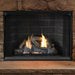 Superior Emberwood Split vent free gas log set burning in a stone fireplace with traditional brick panels