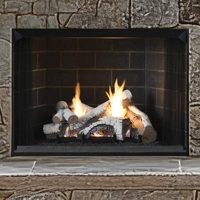 Superior Highridge Birch vent free gas log set burning in a stone fireplace with traditional brick panels