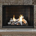 Superior Highridge Birch vent free gas log set burning in a stone fireplace with traditional brick panels