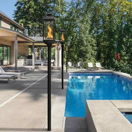 Tempest Lantern in ground mount around pool in backyard