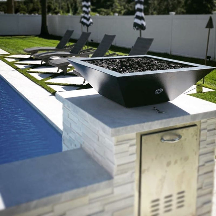The Malibu Square Fire Bowl in Black Concrete Placed at the Poolside with Lava Rock plus Match Lit Ignition System