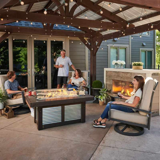 The Outdoor Greatroom Denali Brew Linear Gas Fire Pit Table At the Terrace with Family with Clear Tempered Fire Glass Gems plus Fire Burner On and Glass Wind Guard V1