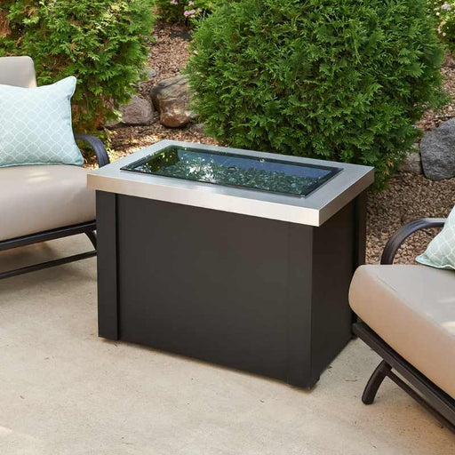 The Outdoor Greatroom Providence Rectangular Gas Fire Pit Table Outdoor with Clear Tempered Fire Glass Gems and Grey Glass Burner Cover Installed 