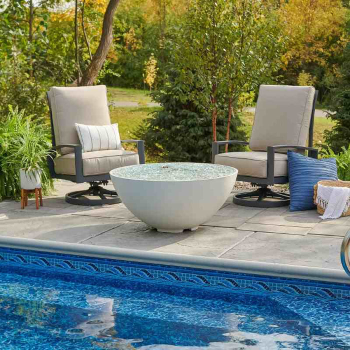 The Outdoor Greatroom White Cove Edge Round Gas Fire Pit Bowl place at Pool Side with Clear Tempered Fire Glass Gems