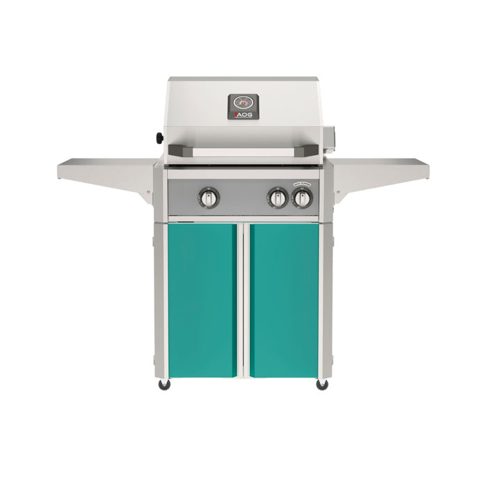 American Outdoor Grill 24" L-Series Portable Gas Grill with gray accent panel and teal accent panel cart base, large analog thermometer and push-button electronic ignition with backlit comfort-touch control knobs.