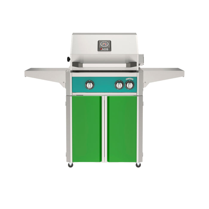 American Outdoor Grill 24" L-Series Portable Gas Grill with teal accent panel and green accent panel cart base, large analog thermometer and push-button electronic ignition with backlit comfort-touch control knobs.