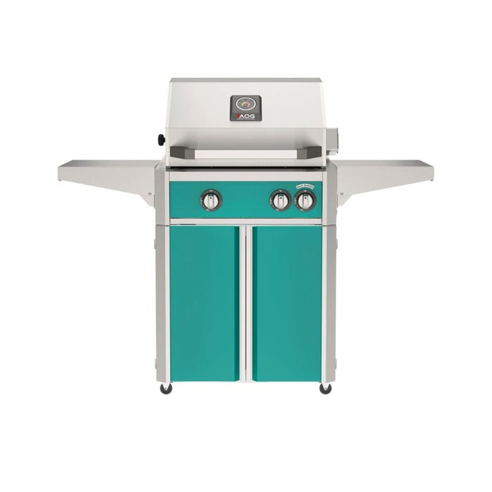 American Outdoor Grill 24" L-Series Portable Gas Grill with teal accent panel and teal accent panel cart base, large analog thermometer and push-button electronic ignition with backlit comfort-touch control knobs.