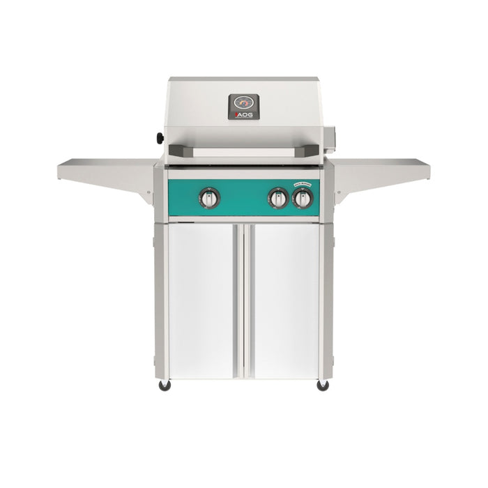 American Outdoor Grill 24" L-Series Portable Gas Grill with teal accent panel and white accent panel cart base, large analog thermometer and push-button electronic ignition with backlit comfort-touch control knobs.