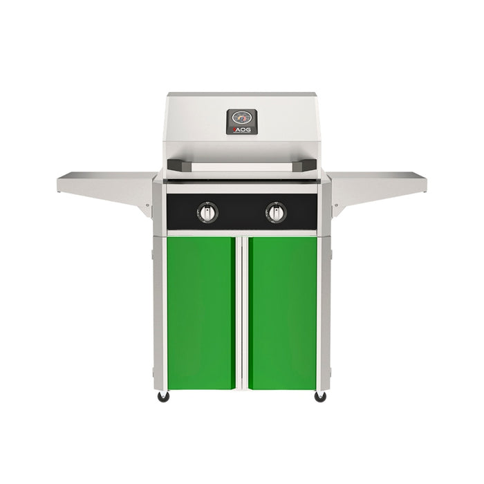 American Outdoor Grill 24" T-Series Portable Gas Grill with black accent panel and green accent panel cart base, large analog thermometer and push-button electronic ignition with backlit comfort-touch control knobs.
