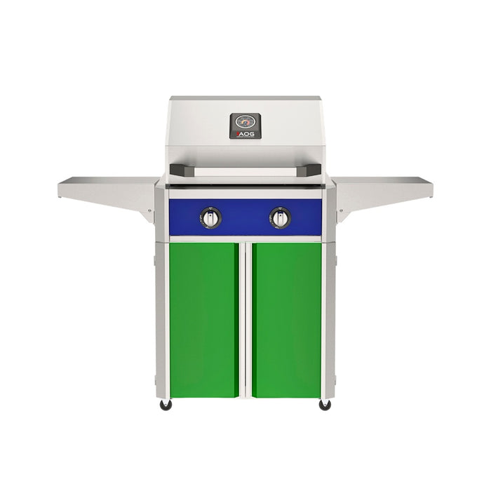 American Outdoor Grill 24" T-Series Portable Gas Grill with blue accent panel and green accent panel cart base, large analog thermometer and push-button electronic ignition with backlit comfort-touch control knobs.
