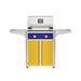 American Outdoor Grill 24" T-Series Portable Gas Grill with blue accent panel and yellow accent panel cart base, large analog thermometer and push-button electronic ignition with backlit comfort-touch control knobs.
