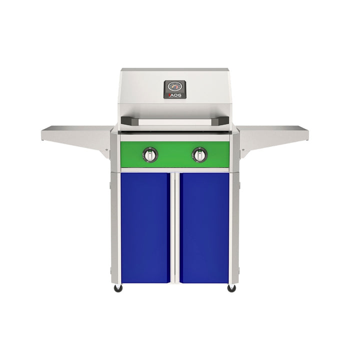 American Outdoor Grill 24" T-Series Portable Gas Grill with green accent panel and blue accent panel cart base, large analog thermometer and push-button electronic ignition with backlit comfort-touch control knobs.
