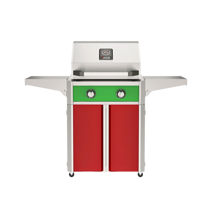 American Outdoor Grill 24" T-Series Portable Gas Grill with green accent panel and red accent panel cart base, large analog thermometer and push-button electronic ignition with backlit comfort-touch control knobs.
