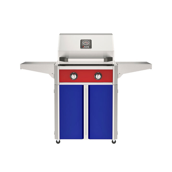 American Outdoor Grill 24" T-Series Portable Gas Grill with red accent panel and blue accent panel cart base, large analog thermometer and push-button electronic ignition with backlit comfort-touch control knobs.
