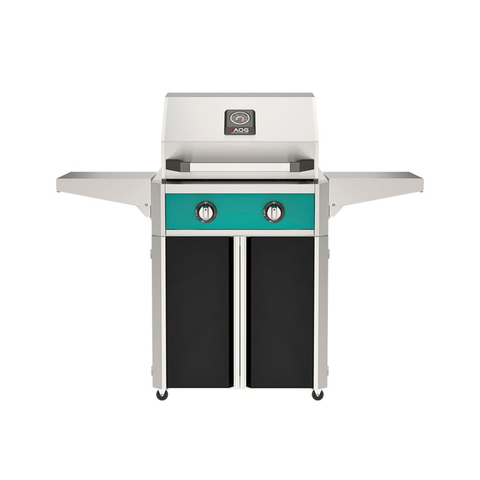 American Outdoor Grill 24" T-Series Portable Gas Grill with teal accent panel and black accent panel cart base, large analog thermometer and push-button electronic ignition with backlit comfort-touch control knobs.
