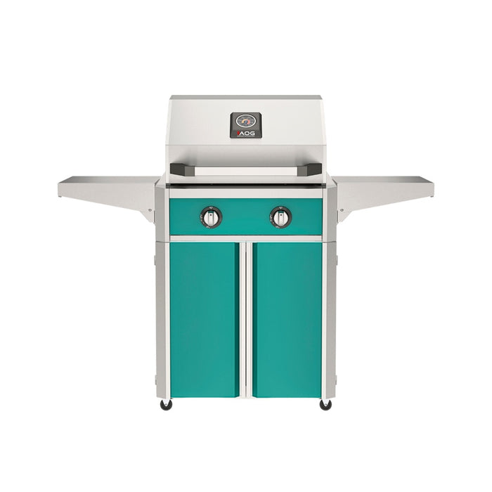 American Outdoor Grill 24" T-Series Portable Gas Grill with teal accent panel and teal accent panel cart base, large analog thermometer and push-button electronic ignition with backlit comfort-touch control knobs.
