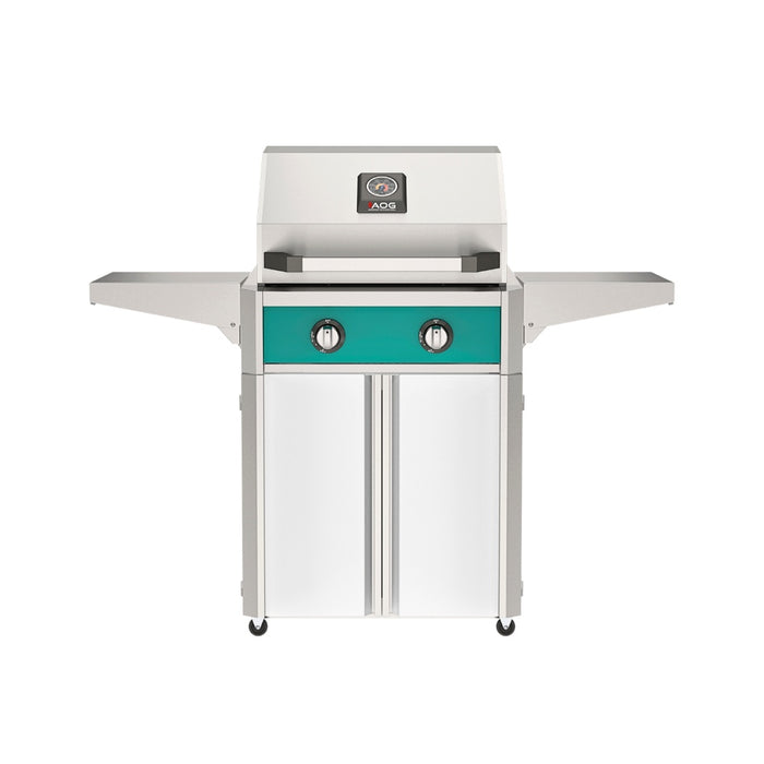 American Outdoor Grill 24" T-Series Portable Gas Grill with teal accent panel and white accent panel cart base, large analog thermometer and push-button electronic ignition with backlit comfort-touch control knobs.
