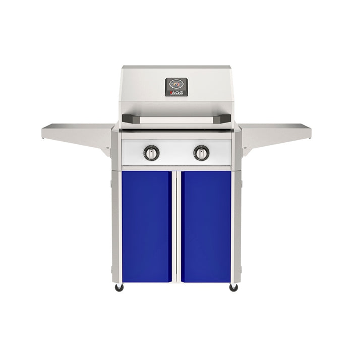 American Outdoor Grill 24" T-Series Portable Gas Grill with white accent panel and blue accent panel cart base, large analog thermometer and push-button electronic ignition with backlit comfort-touch control knobs.
