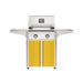 American Outdoor Grill 24" T-Series Portable Gas Grill with white accent panel and yellow accent panel cart base, large analog thermometer and push-button electronic ignition with backlit comfort-touch control knobs.
