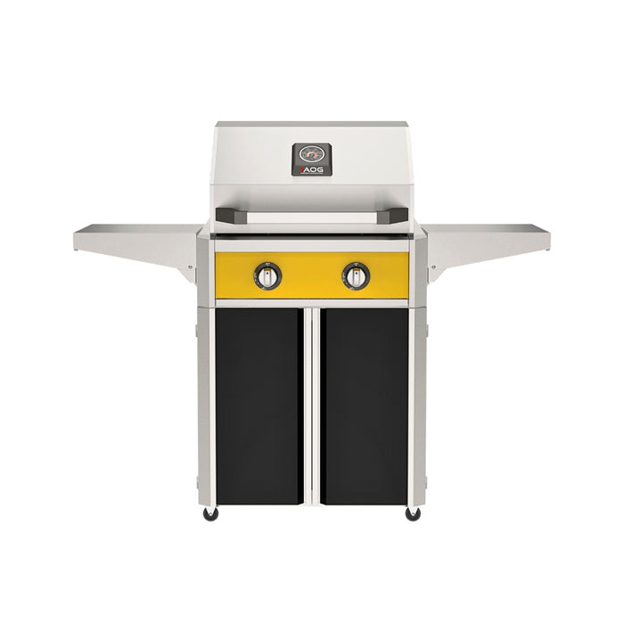 American Outdoor Grill 24" T-Series Portable Gas Grill with yellow accent panel and black accent panel cart base, large analog thermometer and push-button electronic ignition with backlit comfort-touch control knobs.
