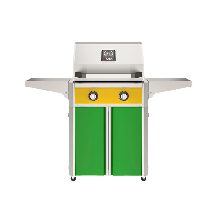 American Outdoor Grill 24" T-Series Portable Gas Grill with yellow accent panel and green accent panel cart base, large analog thermometer and push-button electronic ignition with backlit comfort-touch control knobs.
